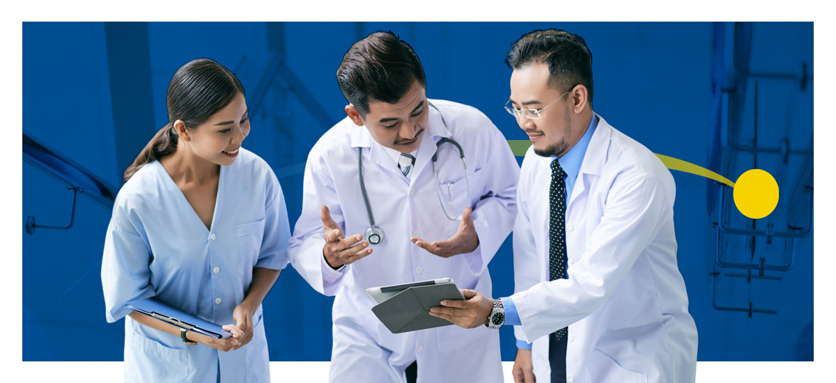 Two doctors and a nurse discuss what they see on a tablet